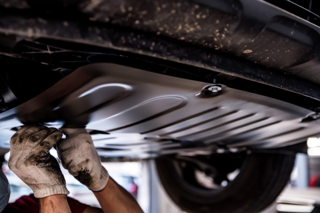 Mechanic working under a car